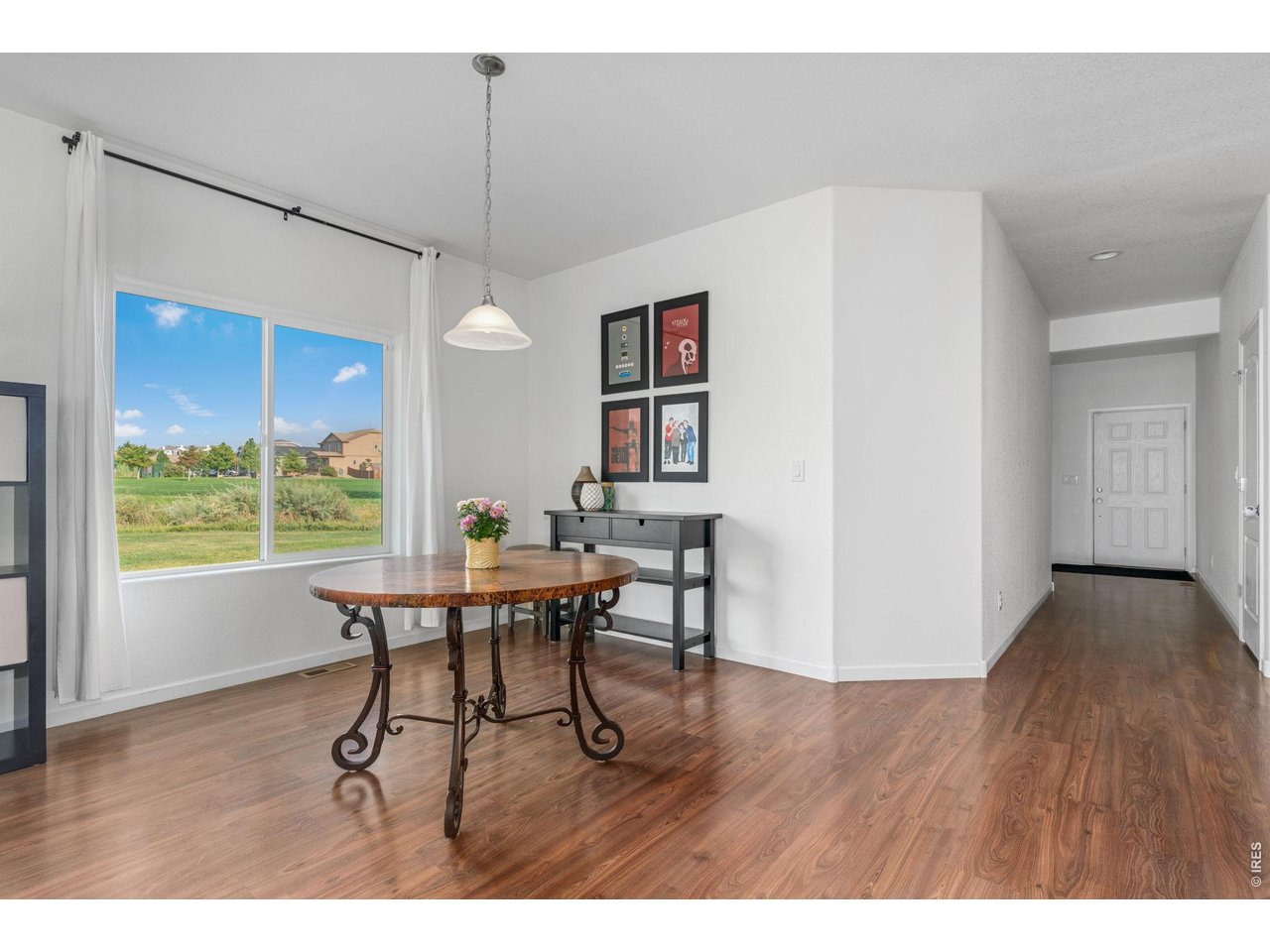 Property Photo 4 The dining room sits conveniently off the kitchen and has views to the open space and park.