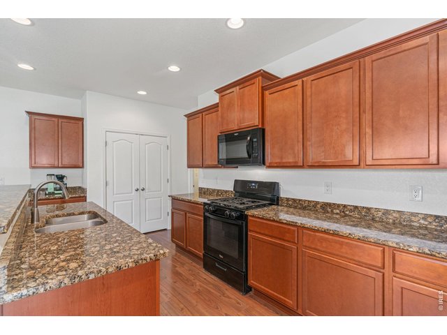 Property Photo 9 The popular gas cooktop, and...