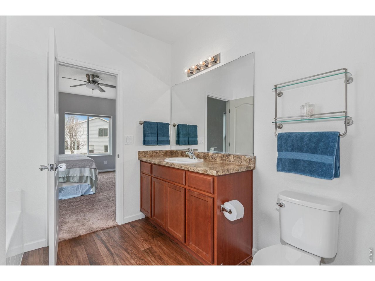 Property Photo 13 En suite has neutral counters and cabinets as well as plenty of natural lighting to fit your needs.