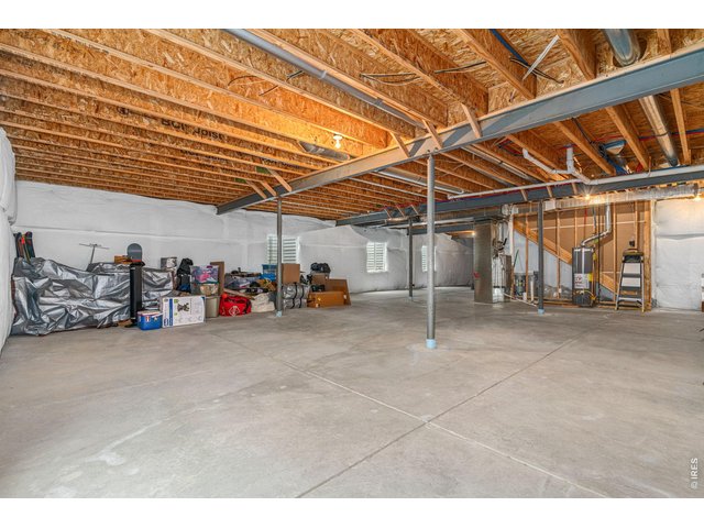 Property Photo 22 Large unfinished basement has 4 large windows and conviently tucked utilities which give you plenty of options if you choose to finish it.