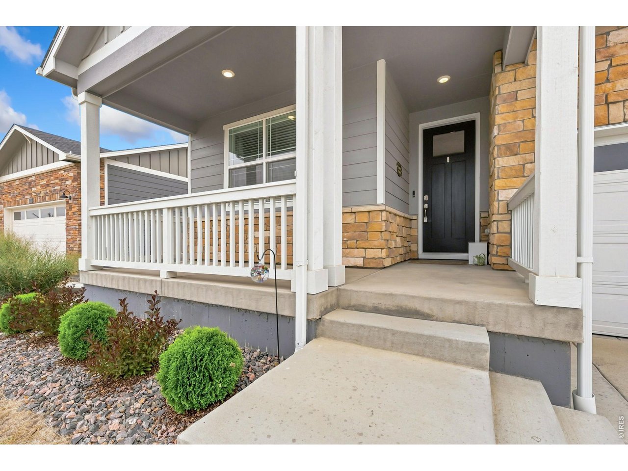Property Photo 3 Relax on the covered front porch with unobstructed views of Longs Peak and the mountains to the west.