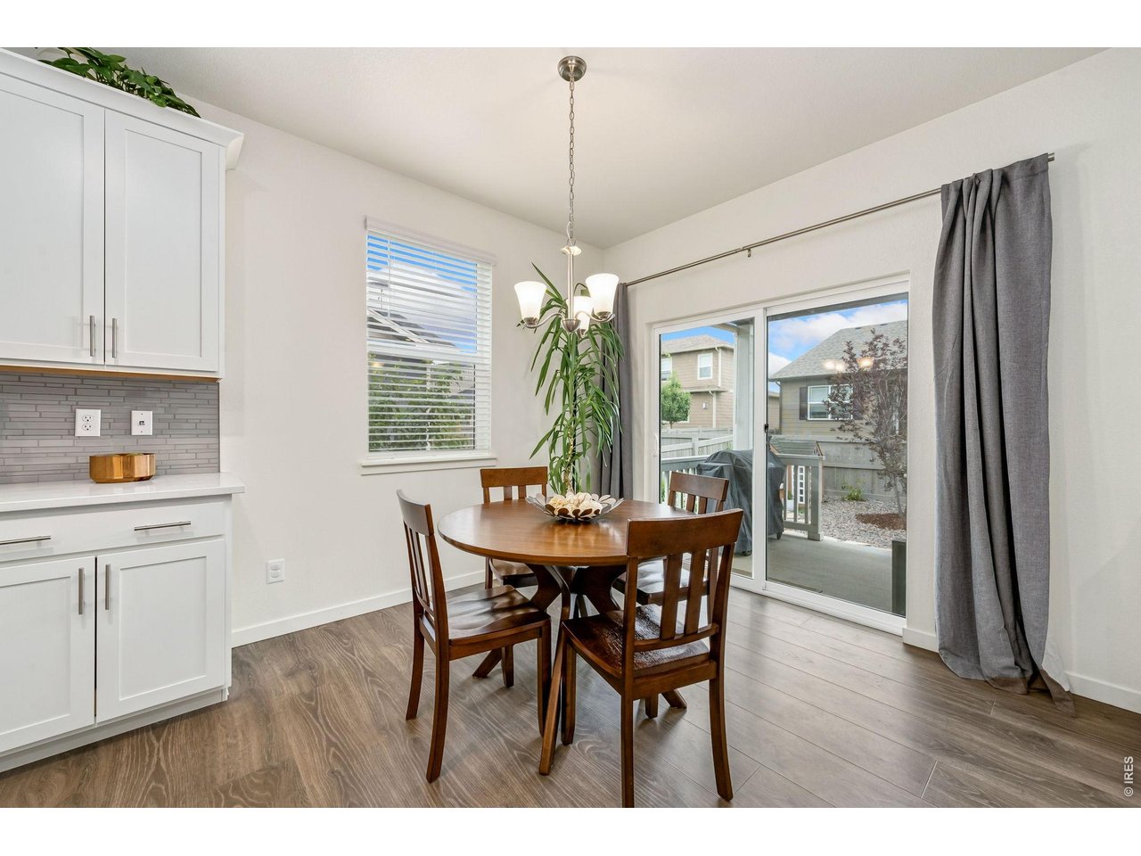 Property Photo 8 Eat-in kitchen opens to covered back patio.