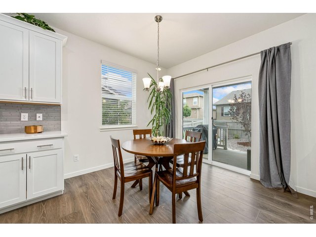 Property Photo 8 Eat-in kitchen opens to covered back patio.