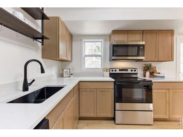 Property Photo 6 Quartz Counters, and Stainless Appliances