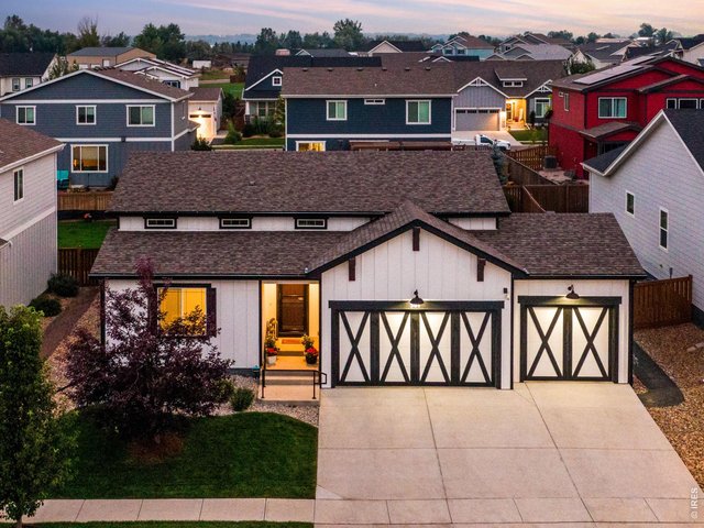 Property Photo 33 prewired for an EV in the garage, both wifi enabled openers & newly poured driveway & 8-0' doors in front & back door.