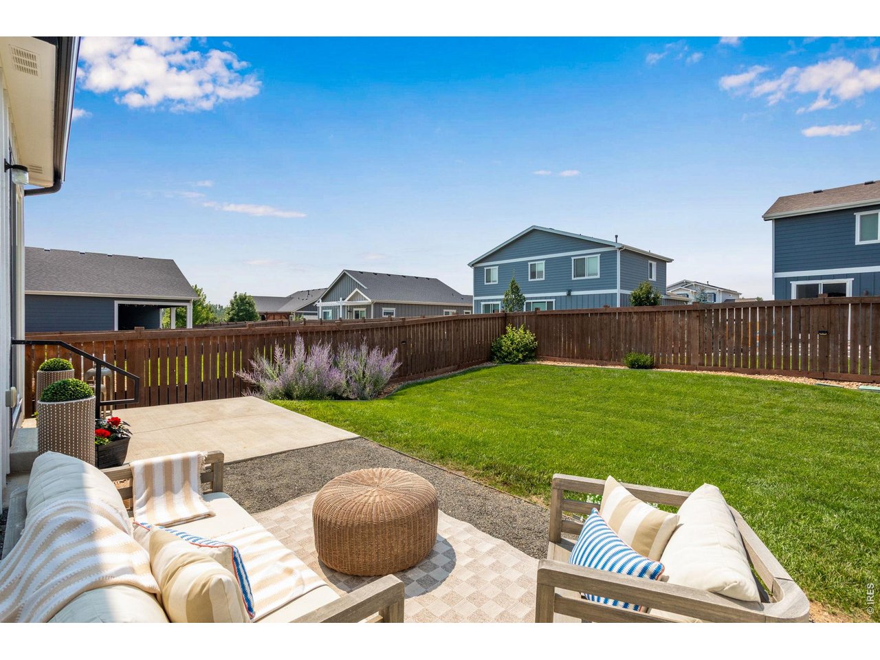 Property Photo 4 Beautifully manicured inside and out. Ideal yard for veggie gardens, easy Colorado outdoor lving.