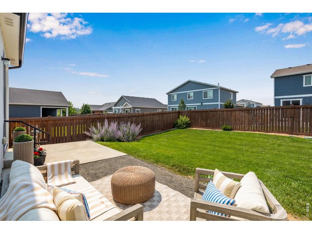 Property Photo 4 Beautifully manicured inside and out. Ideal yard for veggie gardens, easy Colorado outdoor lving.