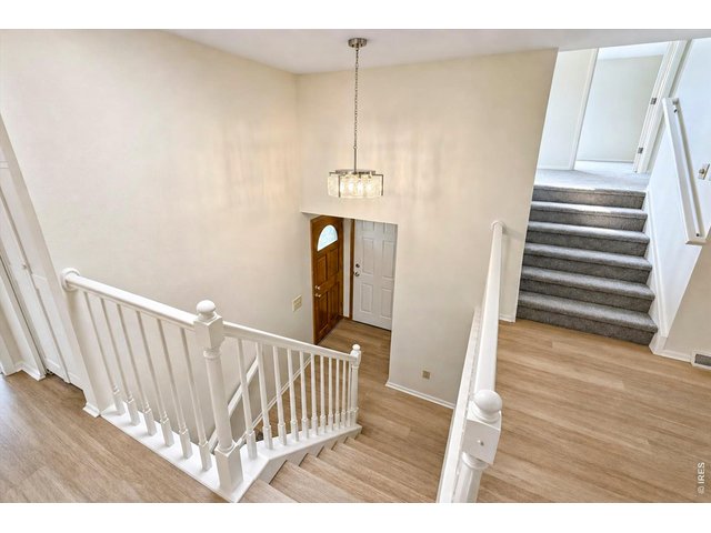 Property Photo 3 Main Level - Foyer Staircase
