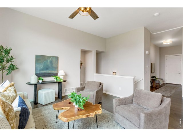 Property Photo 14 Nearly 2,000 finished square feet, warm inviting colors - pretty hand scraped hardwood floors, high ceilings and open concept layout.