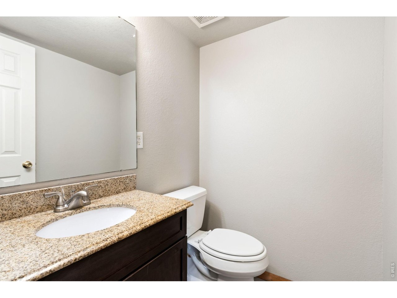 Property Photo 11 Main floor half bath with granite counter