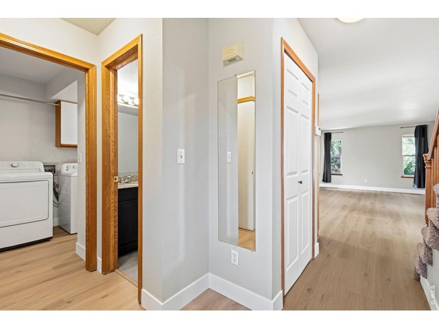 Property Photo 10 Entry way - notice the beautiful new LVP floors and baseboards