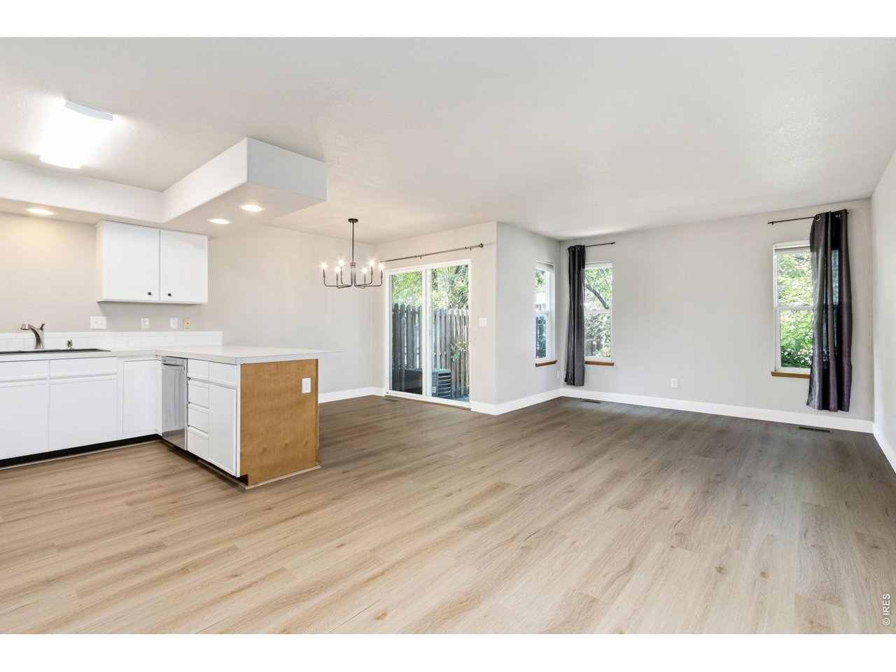 Property Photo 2 Welcome to this freshly updated town-home, boasting new, durable luxury vinyl plank throughout the spacious main level!