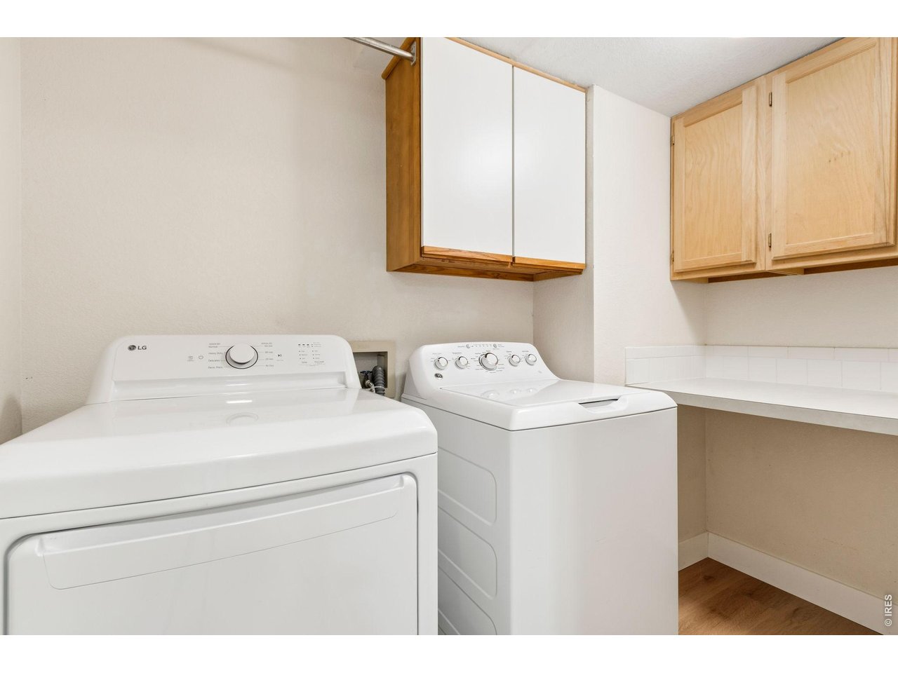 Property Photo 12 Main floor laundry with newer washer and dryer and lots of storage