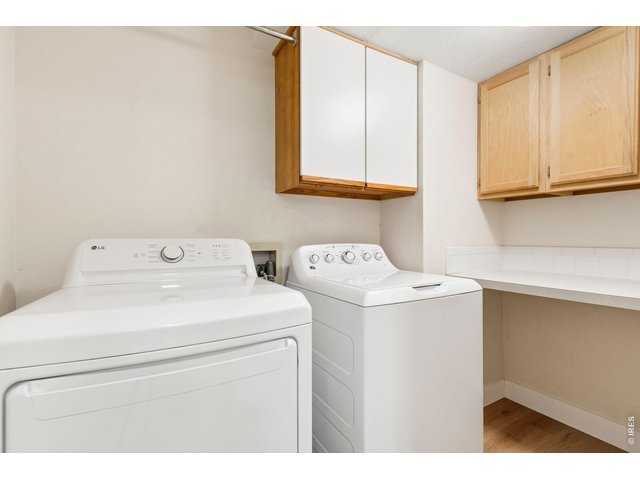 Property Photo 12 Main floor laundry with newer washer and dryer and lots of storage