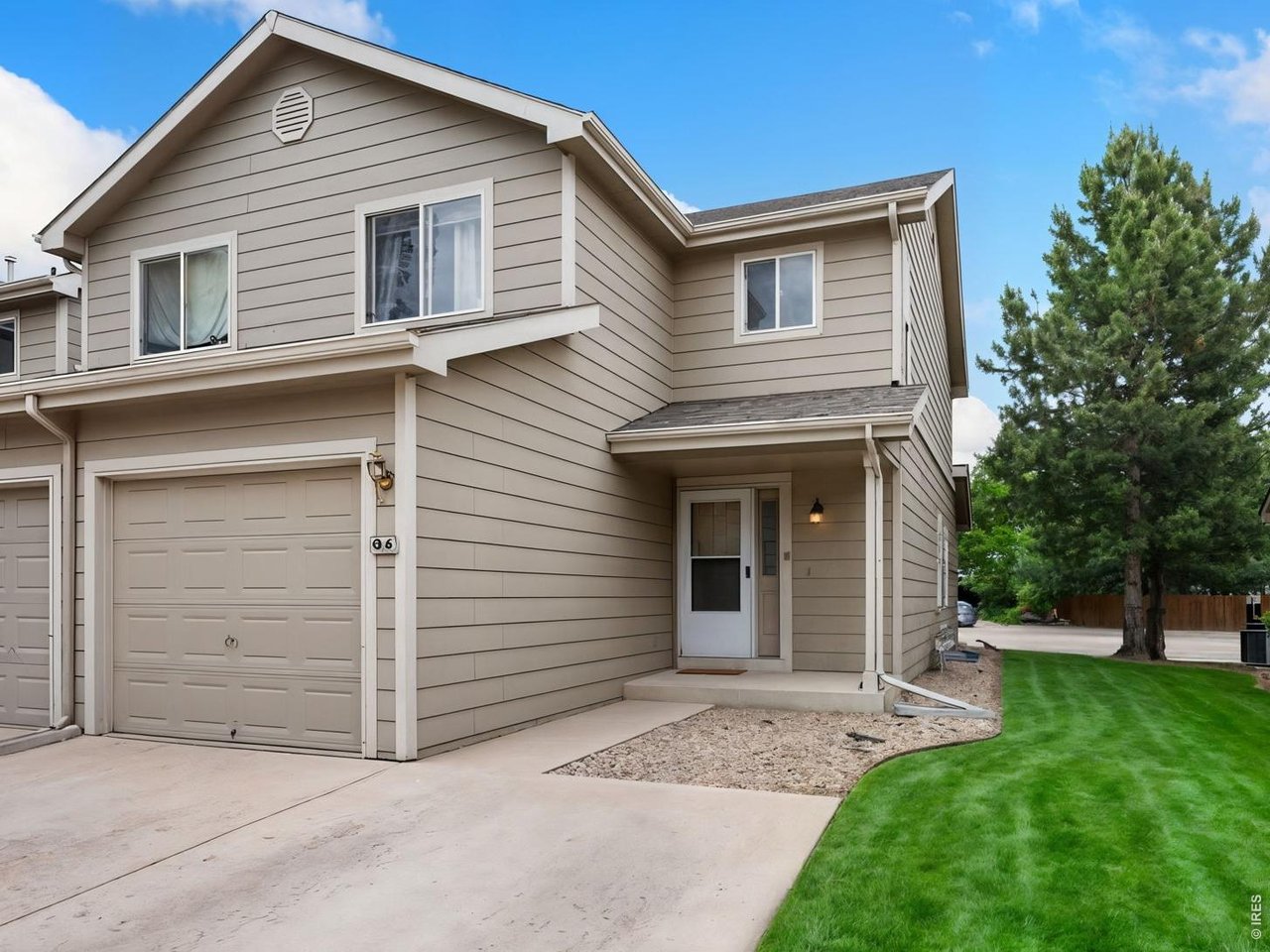 Property Photo 3 End-unit townhome is ideally located near CSU, the vet hospital, natural areas, and downtown Fort Collins! Two driveway parking spaces and an attached garage.