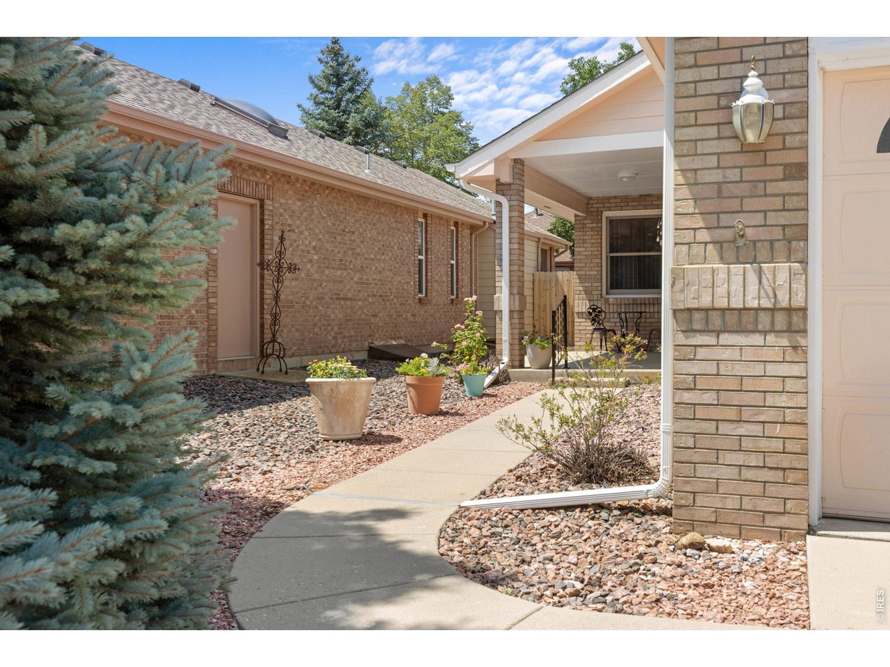 Property Photo 1 Welcome to 809 Zweck. Paved sidewalk to the front porch and entry.