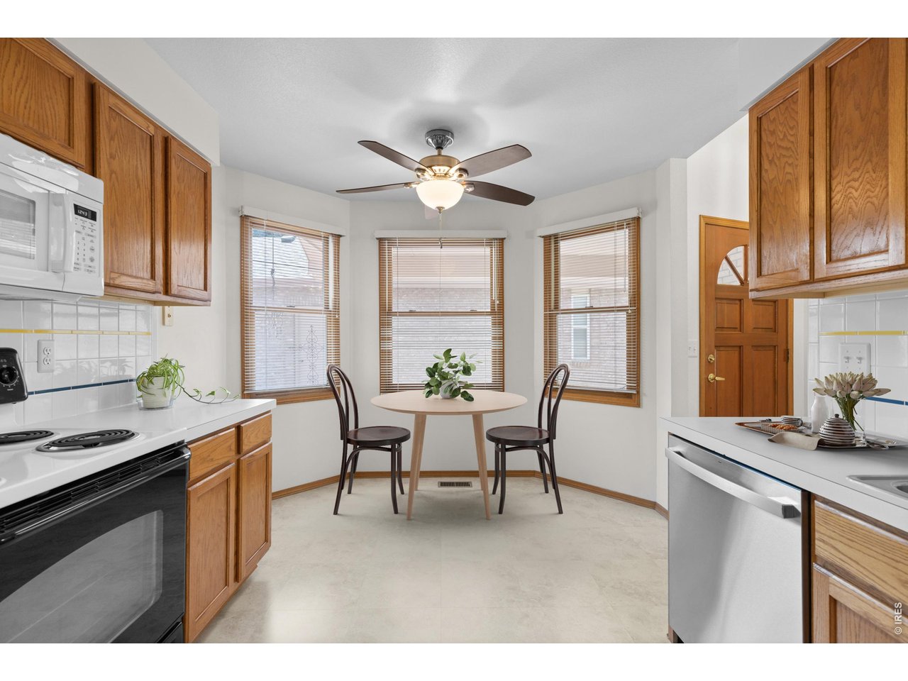 Property Photo 10 Bright breakfast nook in the kitchen. Virtually staged.