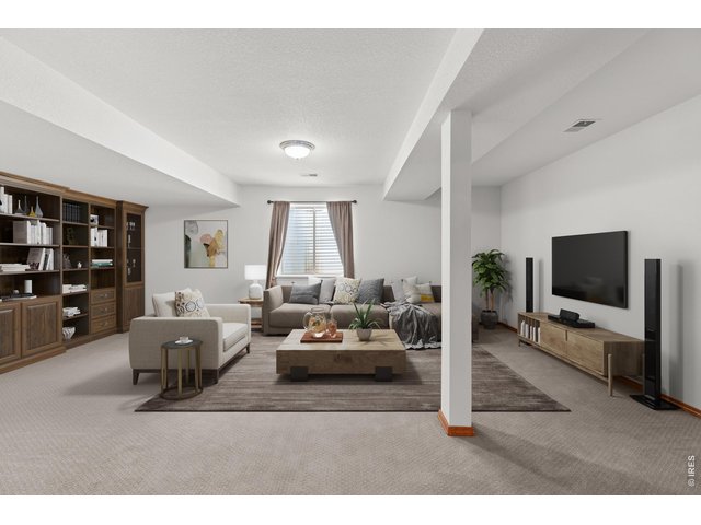 Property Photo 19 Great room in the basement. Lots of space for friends and family. Virtually staged.