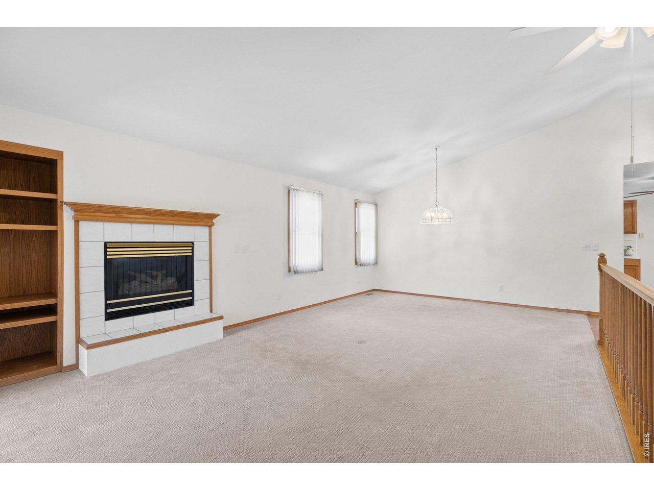 Property Photo 5 Fireplace with built in bookshelves in the living room.