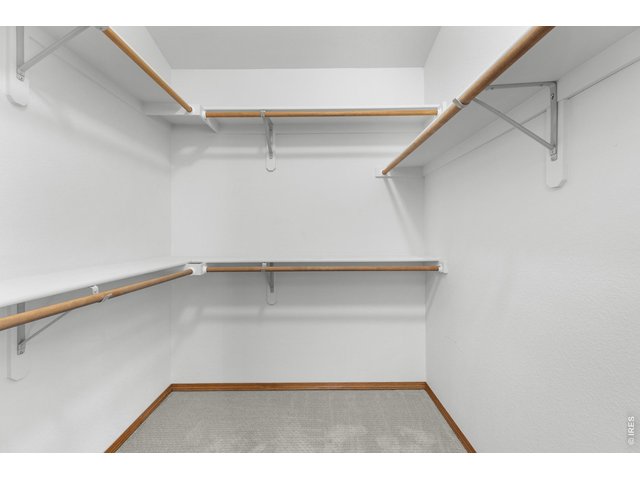 Property Photo 14 Walk-in closet in the primary bedroom.