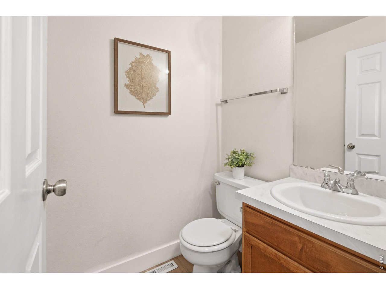 Property Photo 20 Main level powder bath with new flooring and countertops