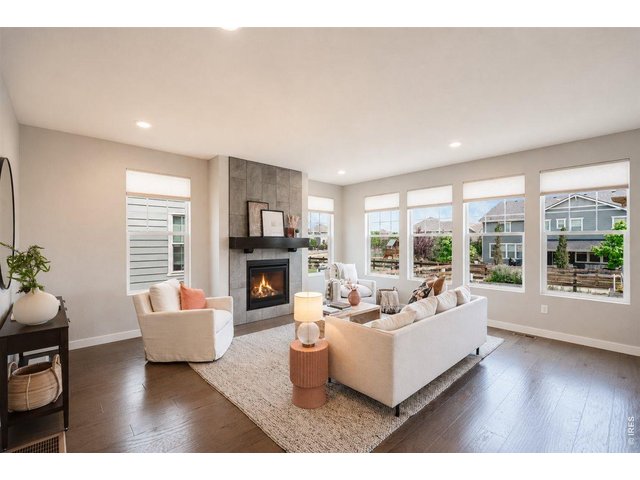 Property Photo 8 Large living room with a gas fireplace.