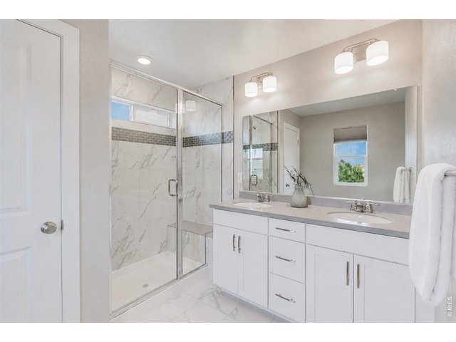 Property Photo 34 The primary bathroom is large and bright, with a good-sized linen closet in it.
