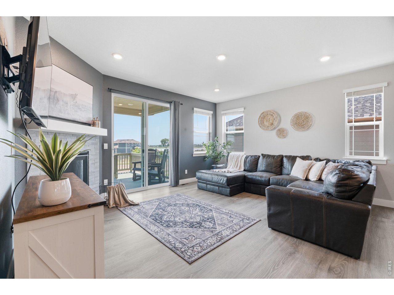 Property Photo 6 Living room has direct views to the back deck with no neighbors directly behind the home.