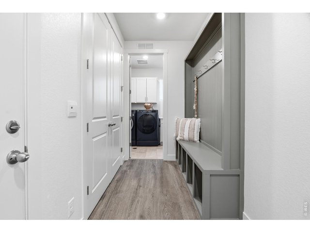 Property Photo 21 Large mudroom with built in storage and ample closet space.