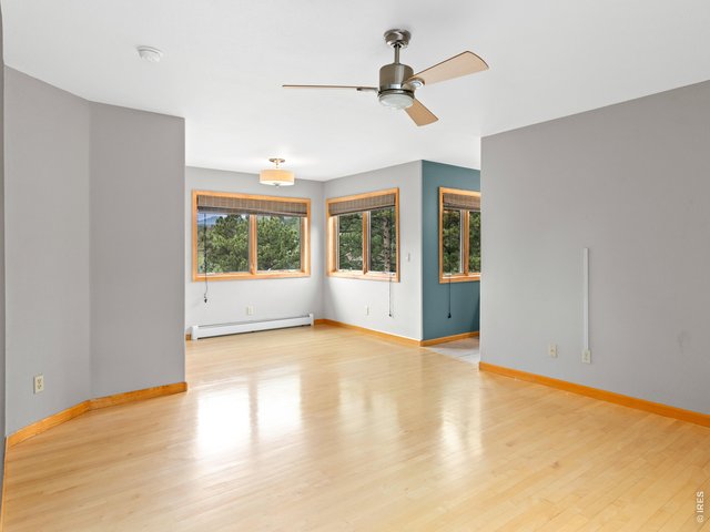 Property Photo 25 Spacious primary bedroom with abundant natural light