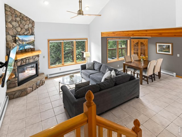 Property Photo 13 Open living and dining area with fireplace