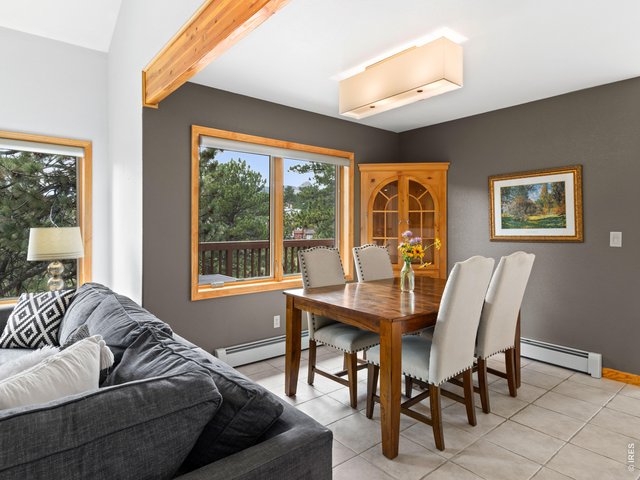 Property Photo 14 Dining area with beautiful wooded views