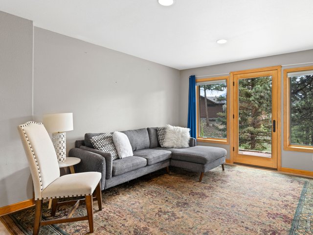 Property Photo 34 Comfortable lower-level living area with patio access