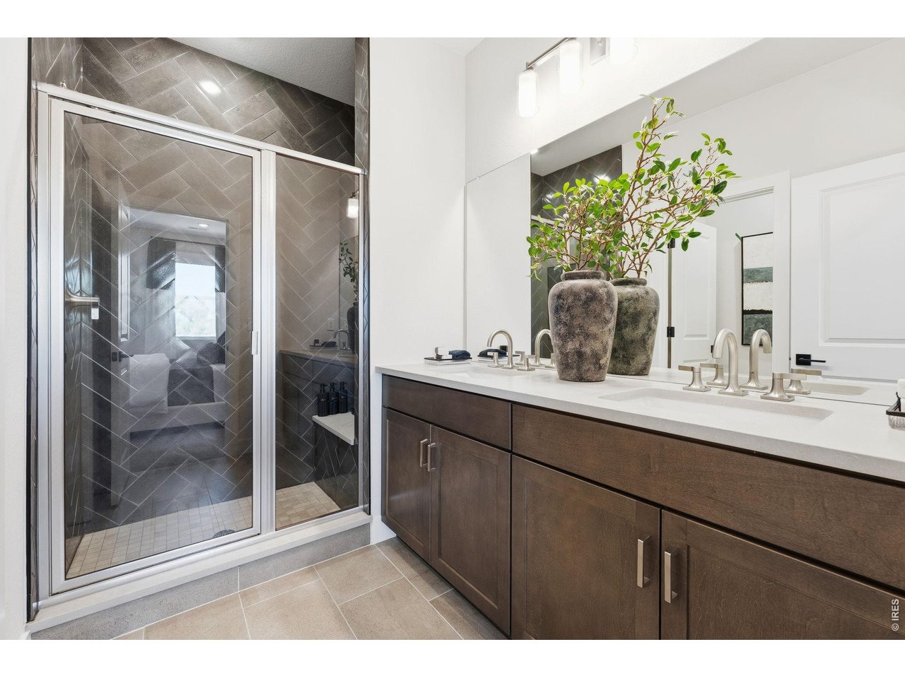 Property Photo 24 Primary Bathroom with Double Sink and Walk-In Shower. Poured Pan and Upgraded Tile