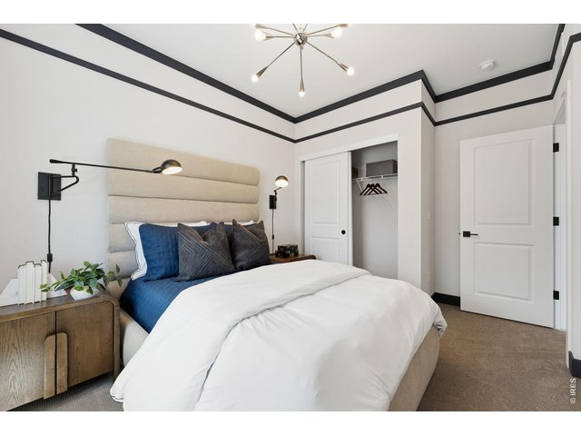Property Photo 31 Bedroom 2 with Molding Details