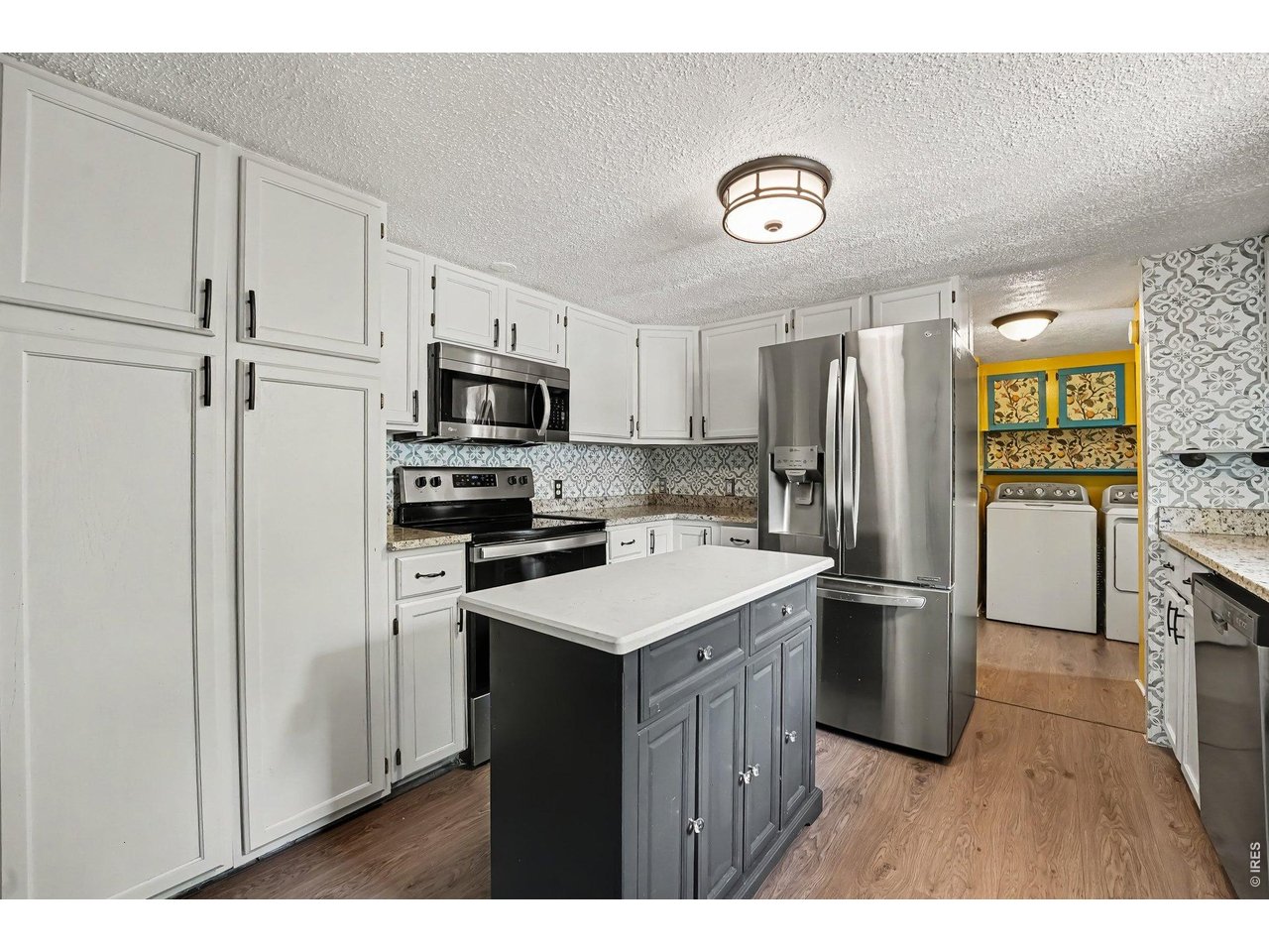 Property Photo 5 Kitchen with stainless steel appliances and lots of cabinet and pantry space