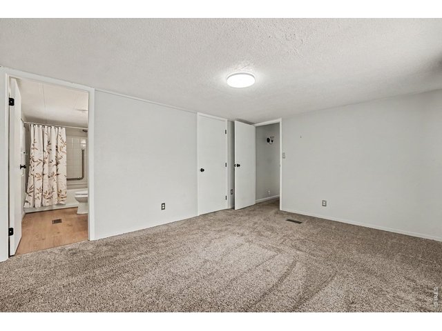 Property Photo 8 Primary Bedroom with en suit bathroom and walk in closet