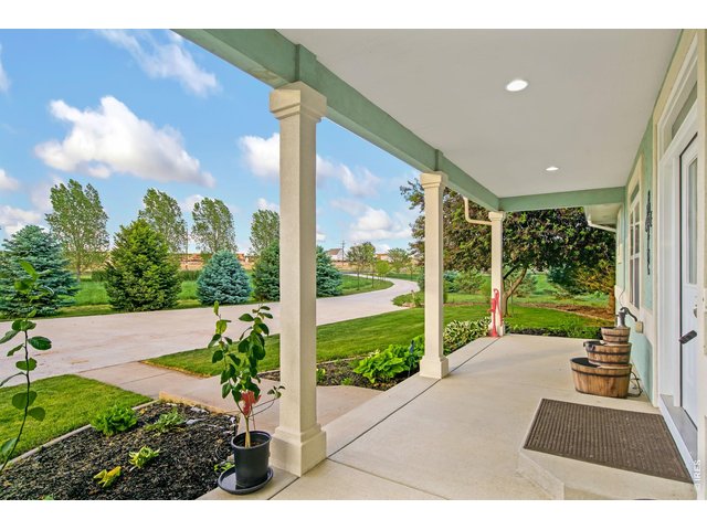 Property Photo 9 North facing covered porch, perfect for your morning coffee.