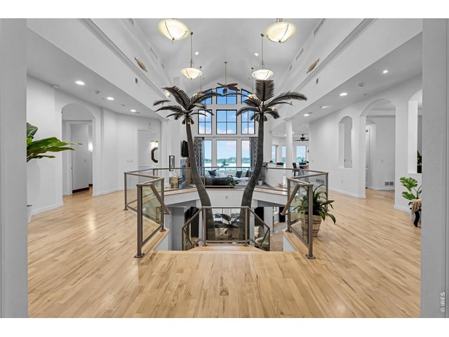 Property Photo 8 Dramatic upper-level overlook showcasing the home s soaring ceilings, open design and distinctive architectural details.