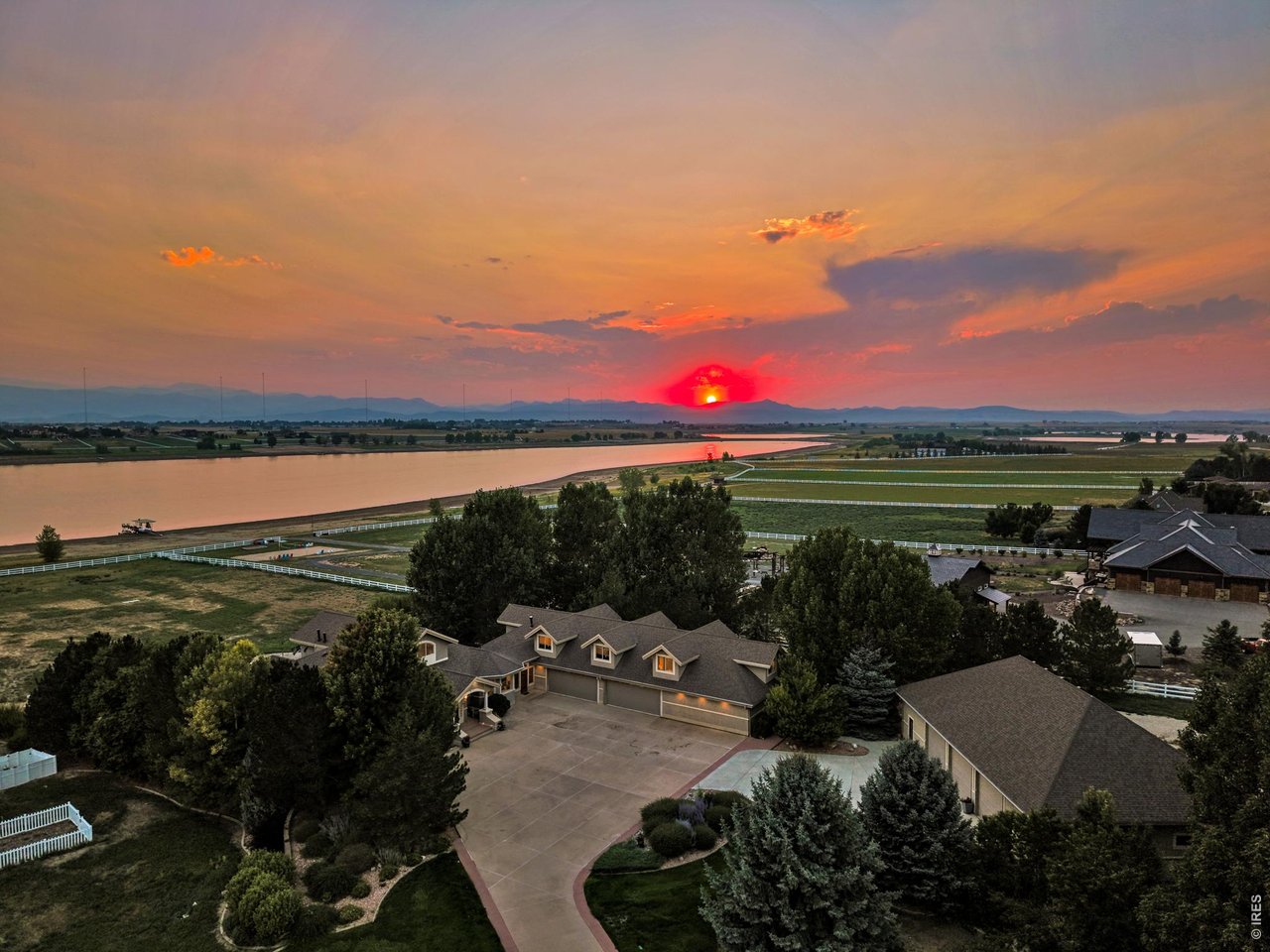 Property Photo 5 Spectacular Colorado sunset with reservoir and Front Range views creating an unforgettable backdrop.