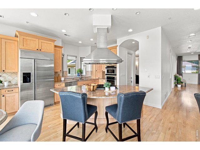 Property Photo 14 Kitchen features abundant cabinetry, granite countertops, stainless appliances and Oven/Microwave