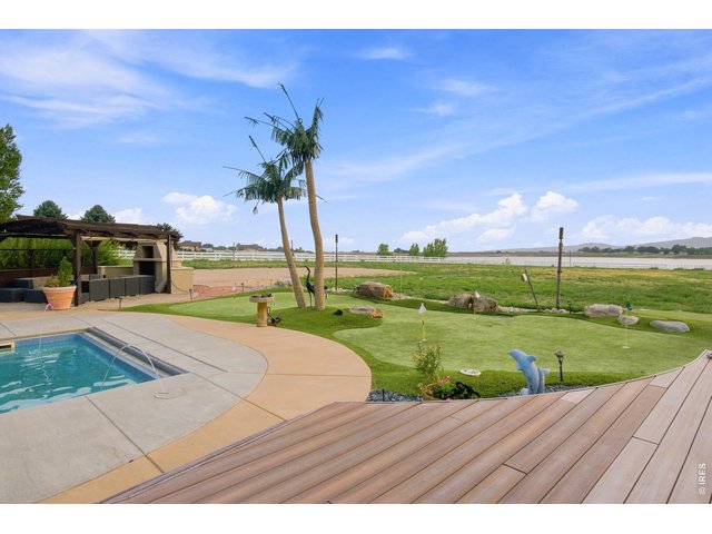 Property Photo 46 Private putting green complements the pool and expansive outdoor recreation space.