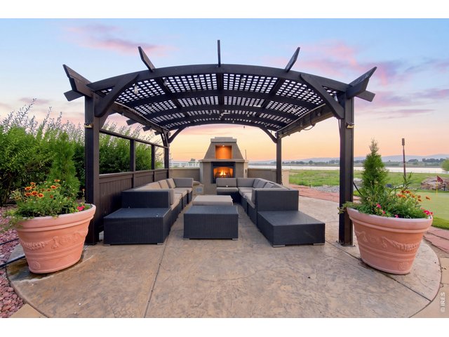 Property Photo 47 Pergola, outdoor living area with fireplace, generous seating and reservoir views.