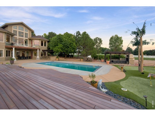Property Photo 48 Backyard Resort View Resort-style backyard featuring a private pool, putting green and expansive outdoor entertaining areas.