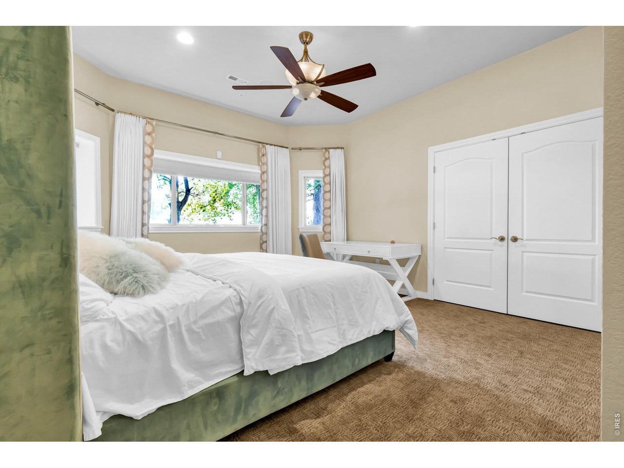 Property Photo 31 Spacious bedroom with multiple windows, generous closet space and abundant natural light.
