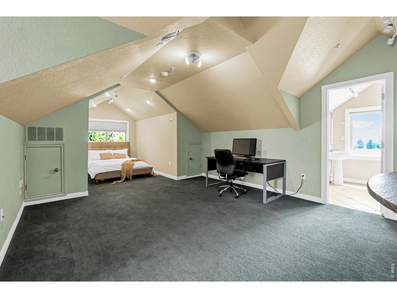 Property Photo 40 Expansive upper-level loft guest quarters offer exceptional flexibility with generous living and sleeping space, plus an adjoining kitchen and bath.