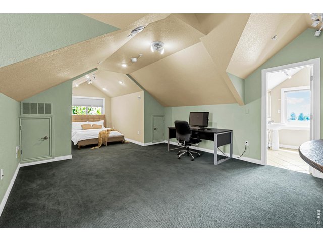 Property Photo 40 Expansive upper-level loft guest quarters offer exceptional flexibility with generous living and sleeping space, plus an adjoining kitchen and bath.