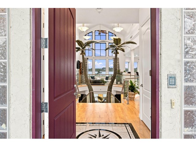 Property Photo 7 Dramatic entry opens to soaring architecture and expansive reservoir views.