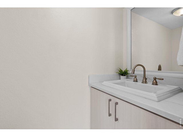 Property Photo 23 Powder room on main with marble countertop on vanity