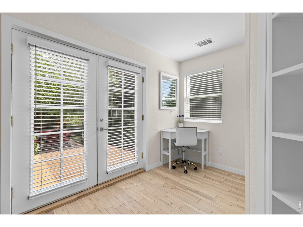 Property Photo 22 Custom french doors lead to deck and verdant garden beyond